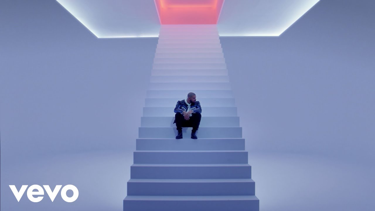 Drake performing live on stage during his record-breaking tour