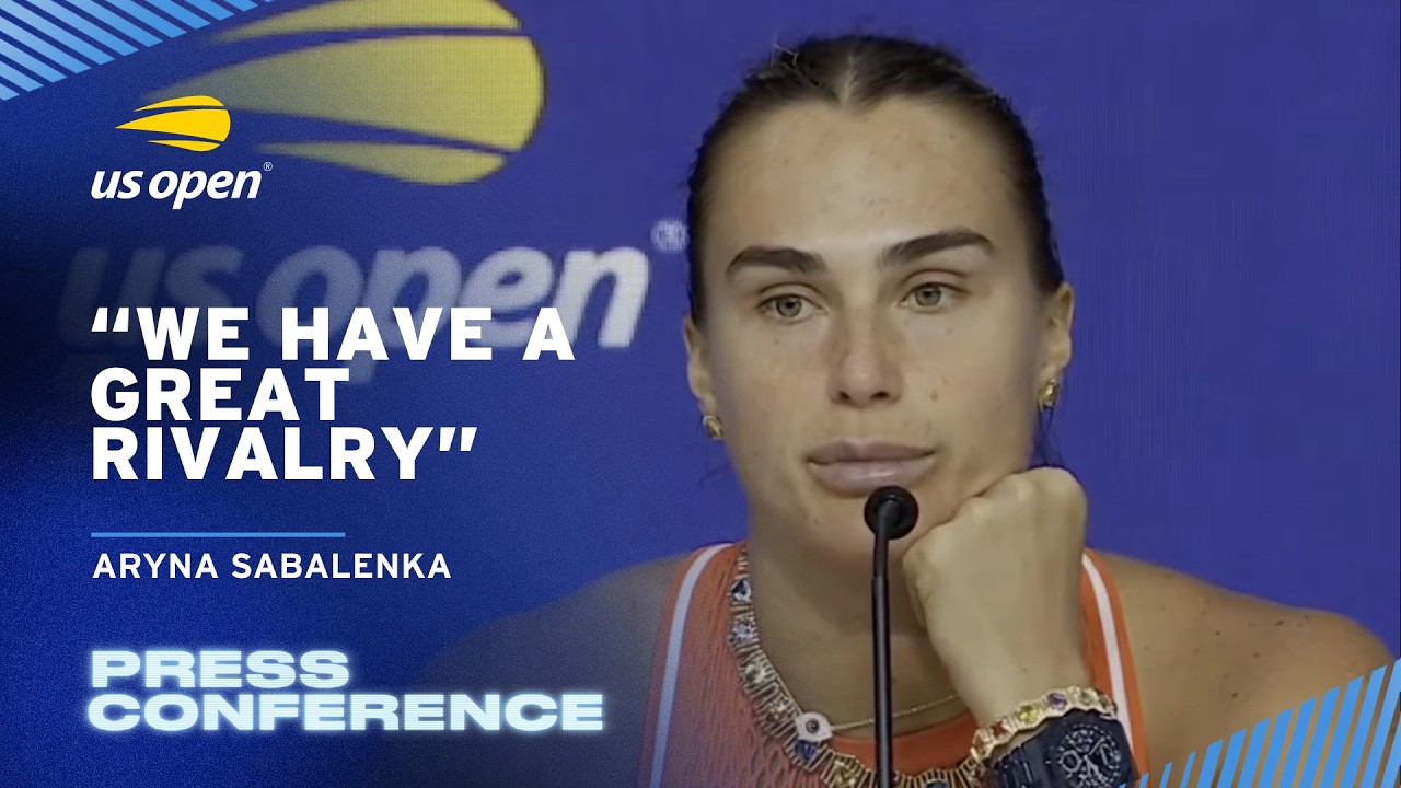 Aryna Sabalenka celebrating with Grand Slam trophy