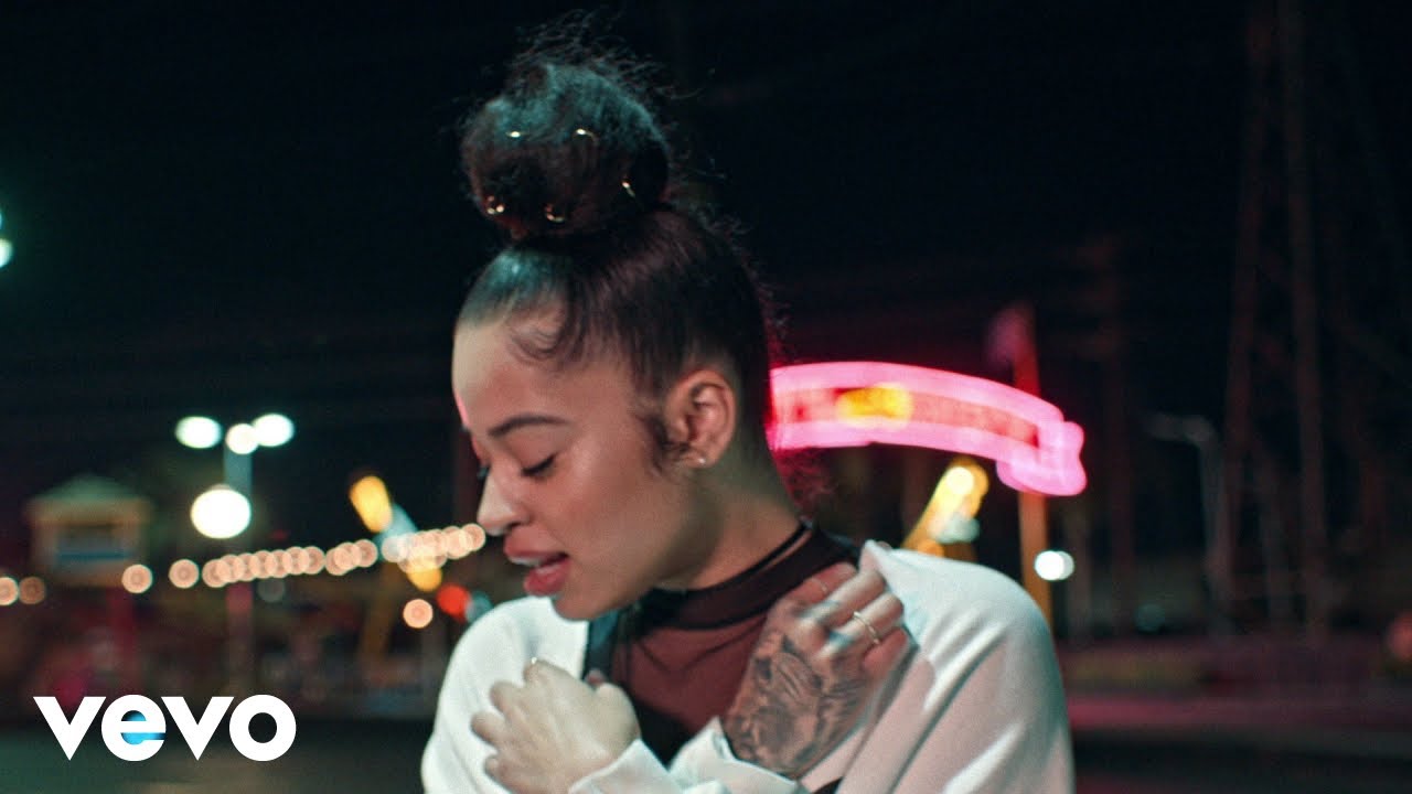 Ella Mai performing on stage